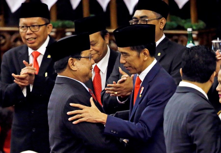 Indonesian President Joko Widodo is congratulated by the Gerindra Party Chairman Prabowo Subianto, who was his former rival in April's election, after his presidential inauguration for the second term, at the House of Representatives building in Jakarta, Indonesia, 20 October 2019. (Achmad Ibrahim/Pool via Reuters)
