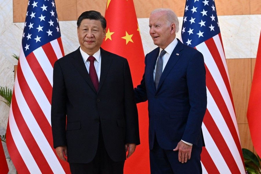US President Joe Biden (right) and China's President Xi Jinping meet on the sidelines of the G20 Summit in Nusa Dua on the Indonesian resort island of Bali on 14 November 2022. (Saul Loeb/AFP)