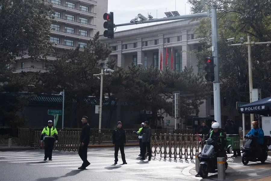 Security personnel gather by Jingxi Hotel as China’s Communist Party leaders open the fifth plenary session of the 20th Central Committee in Beijing, China, on 26 October 2026.