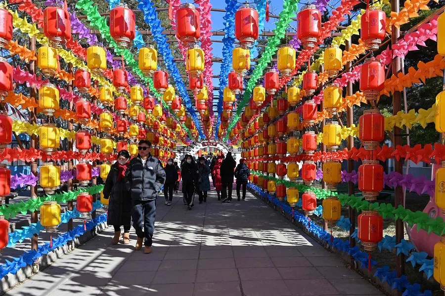 People visit a temple at Yuanmingyuan Park, also known as the Old Summer Palace, in Beijing on 8 February 2025. (Adek Berry/AFP)