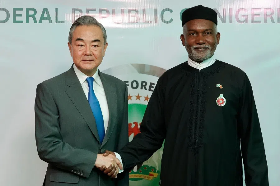 Chinese Foreign Minister Wang Yi (left) shakes hands with Nigeria’s Foreign Affairs Minister Yusuf Tuggar (right) during Minister Wang’s diplomatic visit to Abuja on 9 January 2025. (Kola Sulaimon/AFP)