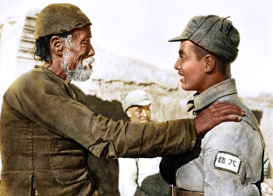An elderly man encourages a young man leaving to join the CCP army, hoping he will come back in victory. Most of the CCP army was made up of farmers.