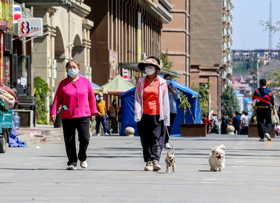 People walk on a street in Urumqi, Xinjiang Autonomous Region, China, 24 August 2022. (CNS)