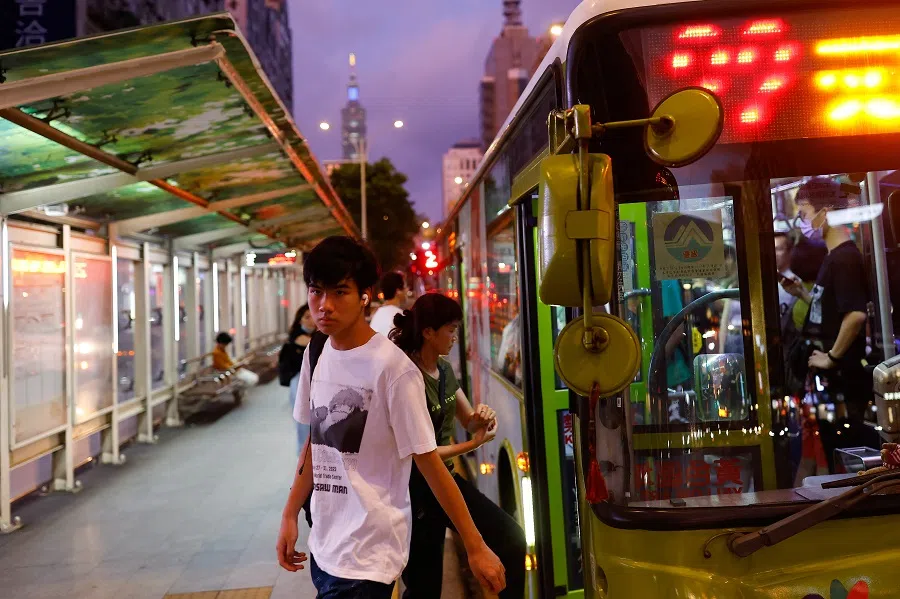 People get off a bus in Taipei, Taiwan, on 2 September 2023. (Ann Wang/Reuters)