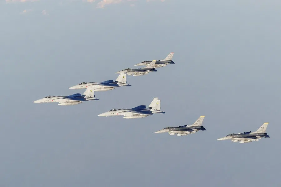 This handout photo taken and released by Japan's defence ministry on 18 November 2022 shows members of Japan's Self-Defense Forces and US Armed Forces conducting a bilateral exercise over the Sea of Japan, also known as the East Sea. (Handout/Japan's Ministry of Defense/AFP)
