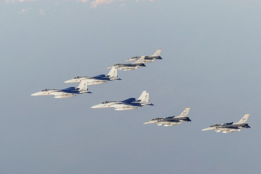 This handout photo taken and released by Japan's defence ministry on 18 November 2022 shows members of Japan's Self-Defense Forces and US Armed Forces conducting a bilateral exercise over the Sea of Japan, also known as the East Sea. (Handout/Japan's Ministry of Defense/AFP)