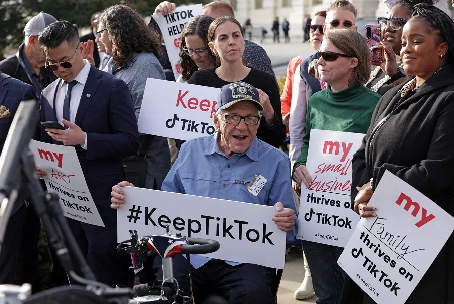Supporters of TikTok listen during a news conference in front of the US Capitol on 22 March 2023 in Washington, DC, US. (Alex Wong/Getty Images/AFP)