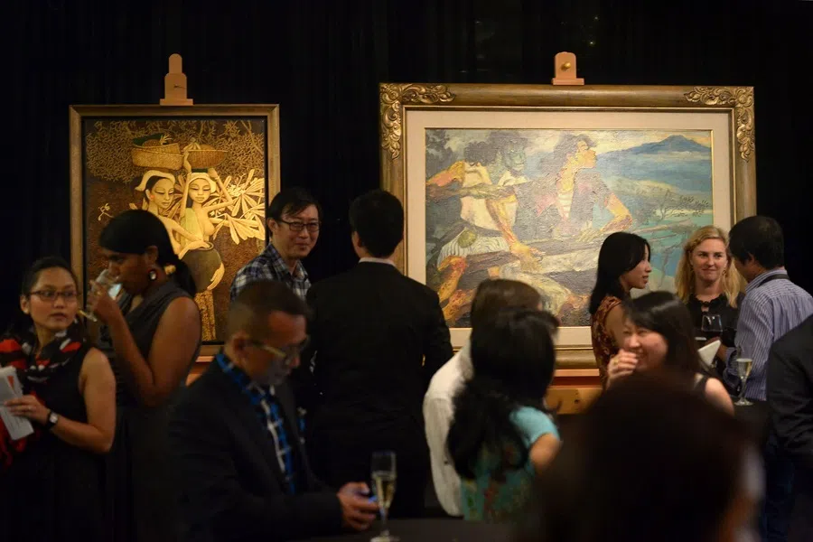 Cheong Soo Pieng’s Returning From Market (left), along with Hendra Gunawan’s War And Peace (right), at the National Gallery Singapore, April 2014.