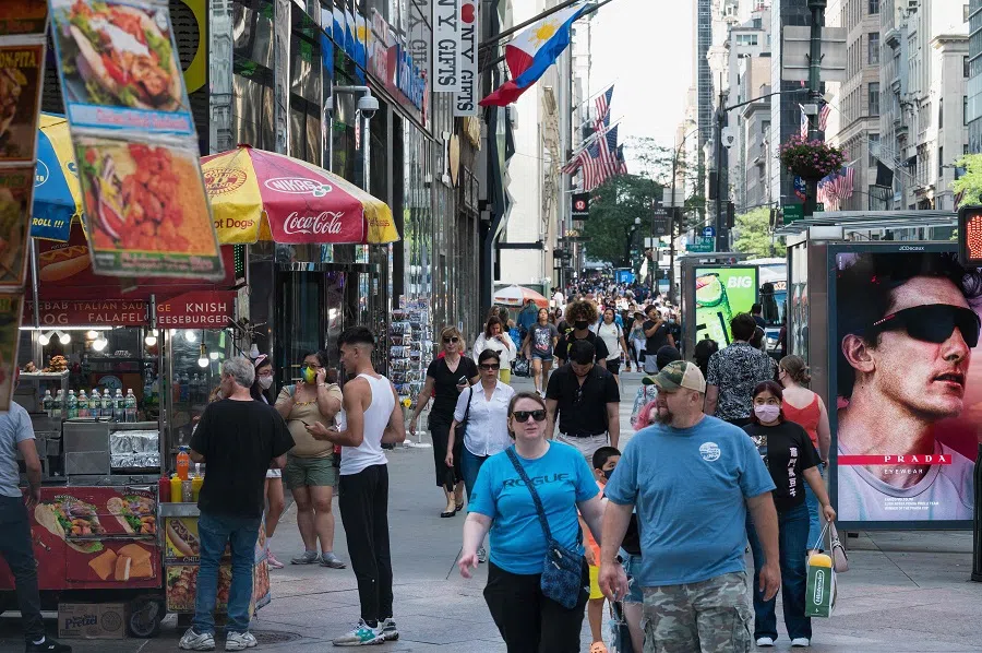 People walk down Fifth Avenue on 25 June 2021 in New York City, US. (Angela Weiss/AFP)