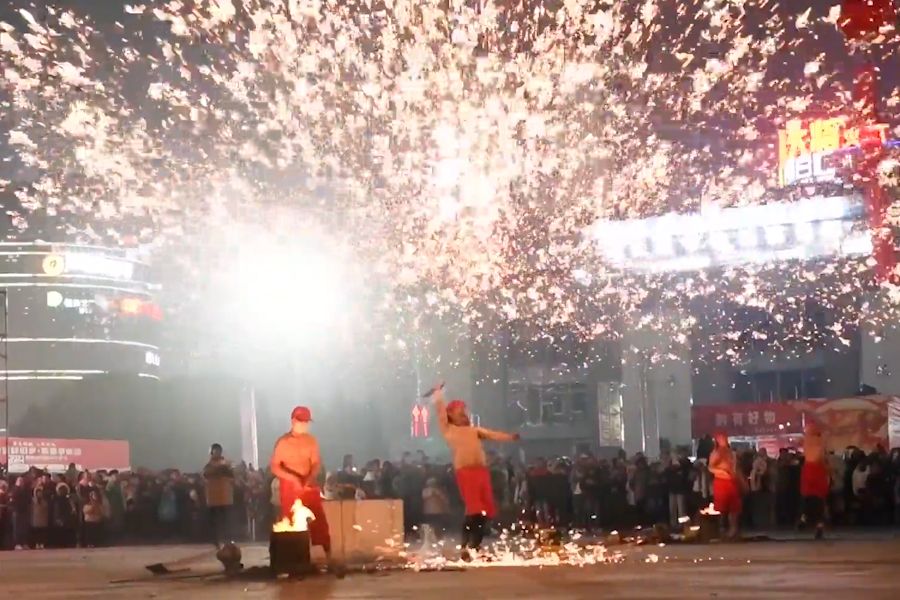 Shirtless performers strike molten iron at Xingyi, Qianxinan Buyi and Miao Autonomous Prefecture, Guizhou province, China, on 27 January 2024. (NurPhoto via Reuters Connect)