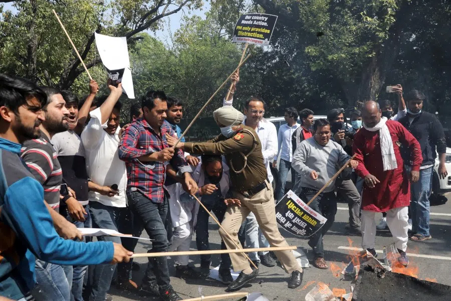 A policeman pushes demonstrators during a protest of supporters of Indian Youth Congress (IYC) demanding immediate evacuation of Indian students from Ukraine, near the India's foreign minister's residence in New Delhi, India, 1 March 2022. (Anushree Fadnavis/Reuters)