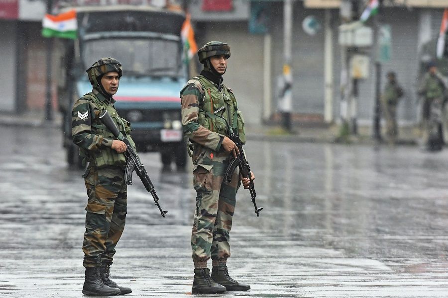 Indian paramilitary troopers stand guard along a street on the country's 75th Independence Day in Srinagar, India, on 15 August 2022. (Tauseef Mustafa/AFP)