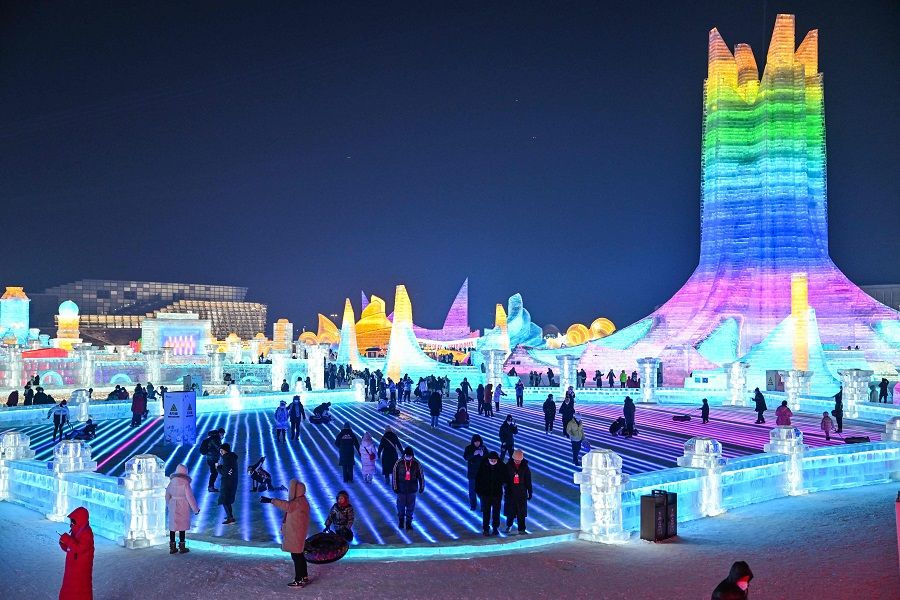 People visit the Harbin Ice and Snow World in Harbin, Heilongjiang province, China, on 5 January 2023. (Hector Retamal/AFP)