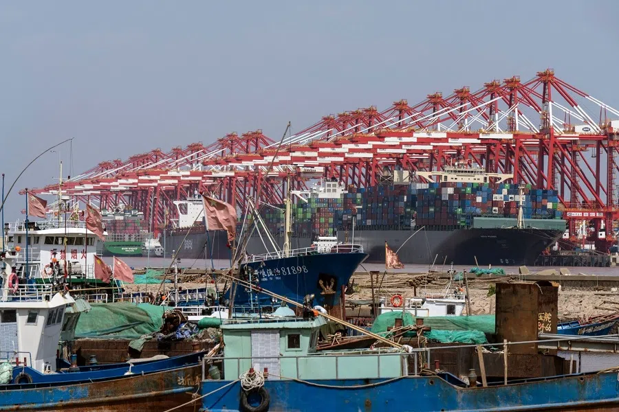 Gantry cranes and container ships at the Yangshan Deepwater Port in Shanghai, China, on 14 May 2025. (Qilai Shen/Bloomberg)