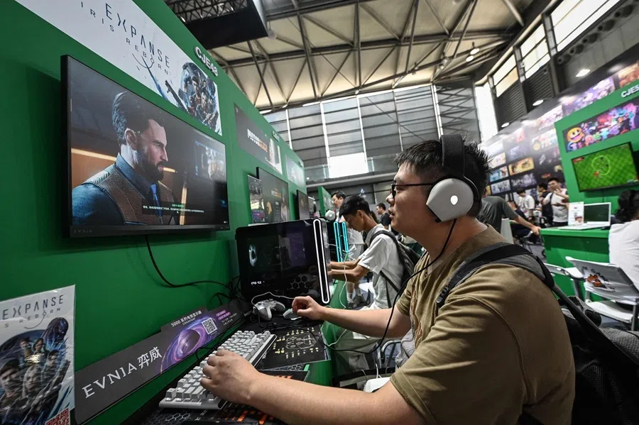 A man plays video games at ChinaJoy, in Shanghai on 31 July 2026.