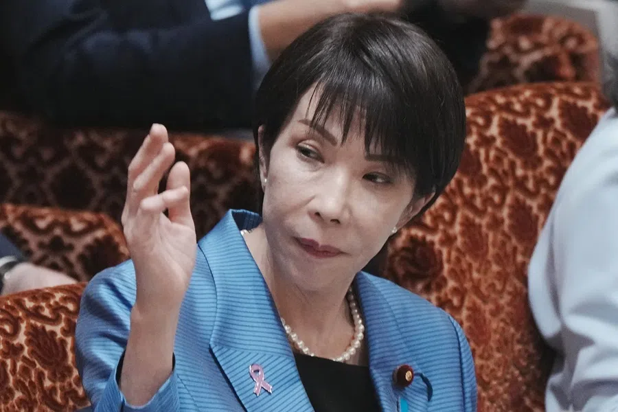 Japan’s Prime Minister Sanae Takaichi raises her hand to answer a question during a session of the House of Councillors Budget Committee at the National Diet in Tokyo on 12 November 2025.