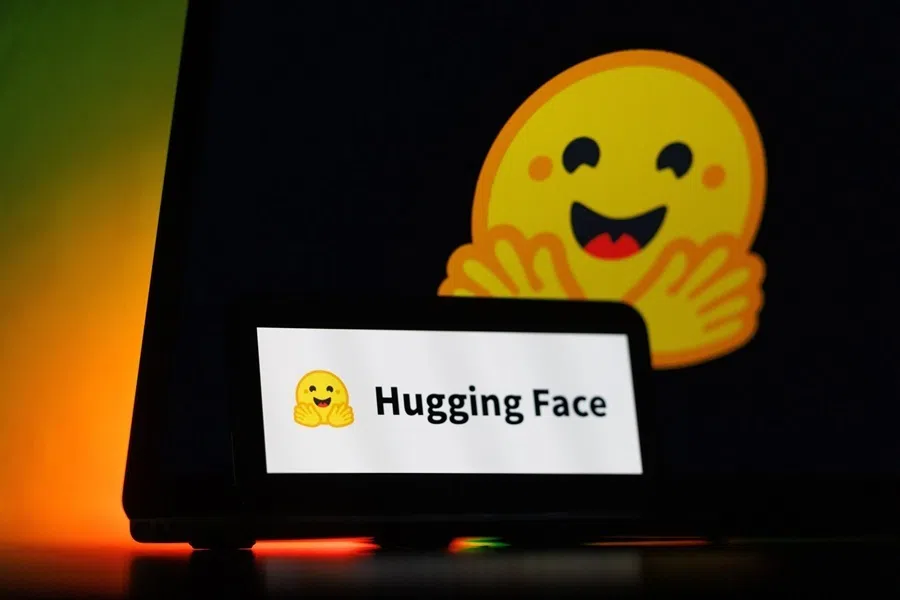 The logo of Hugging Face Inc. AI startup on a smartphone and laptop, on 9 August 2026.