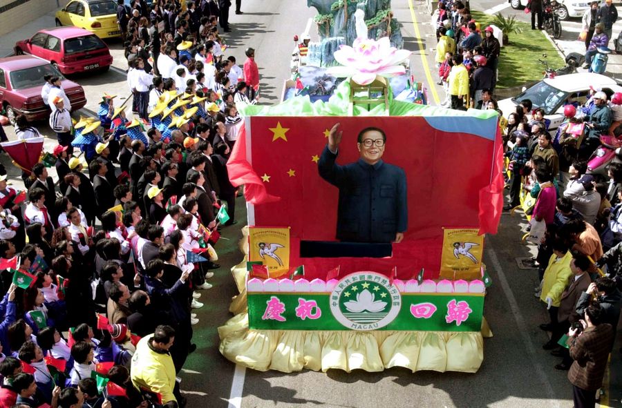 The people of Macau felt a strong sense of belonging to China and welcomed the handover. The photo shows a celebration parade of floats and dancers weaving through the streets of Macau in celebration of the return of Macau to China in 1999. (SPH)
