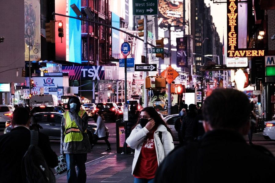 People walk through Times Square on 3 November 2021 in New York City, US. (Spencer Platt/Getty Images/AFP)