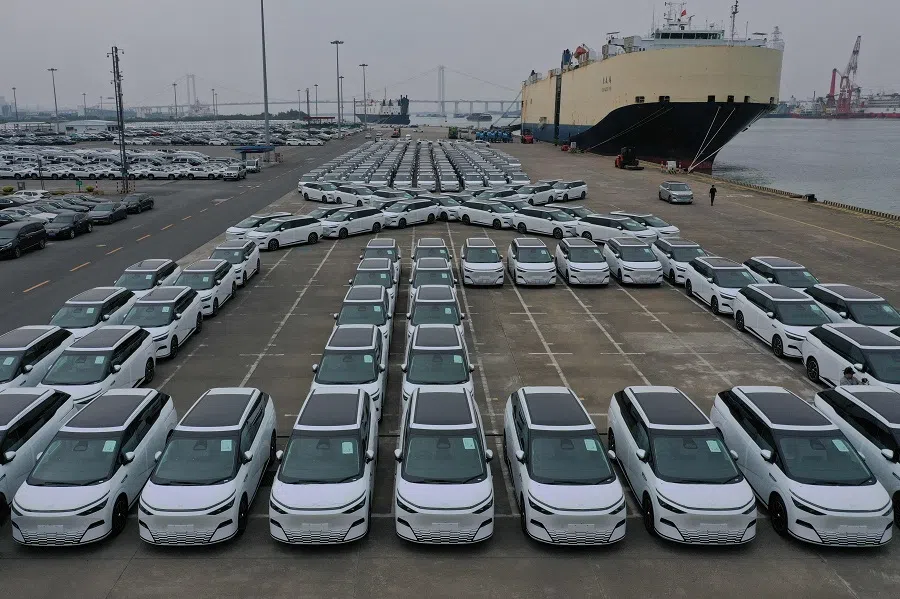 An aerial photo shows X9 electric vehicles by Chinese EV manufacturer XPeng, waiting to be loaded on a ship of the NYK line for Thailand during a ceremony in the Port of Guangzhou, China’s southern Guangdong province on 22 February 2025. (Pedro Pardo/AFP)