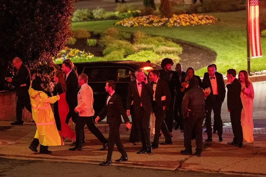 Attendees leave the venue as a shooter opens fire during the annual White House Correspondents' Association Dinner in Washington, DC, US, 25 April 2026. (Ken Cedeno/Reuters)