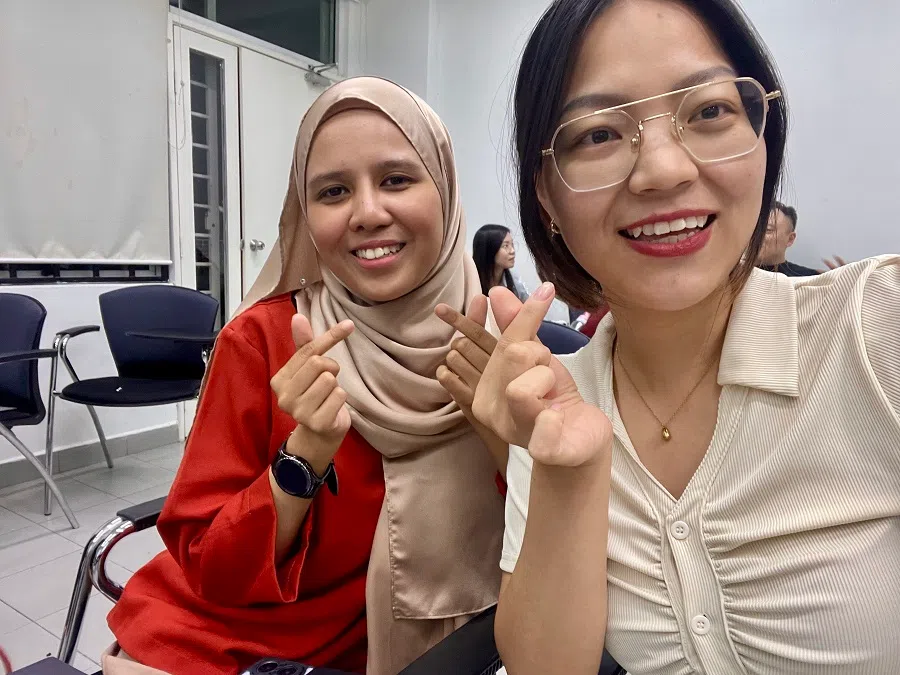 Zhang Xianghua (right), a Chinese graduate student currently studying at UM. (Photo provided by interviewee)