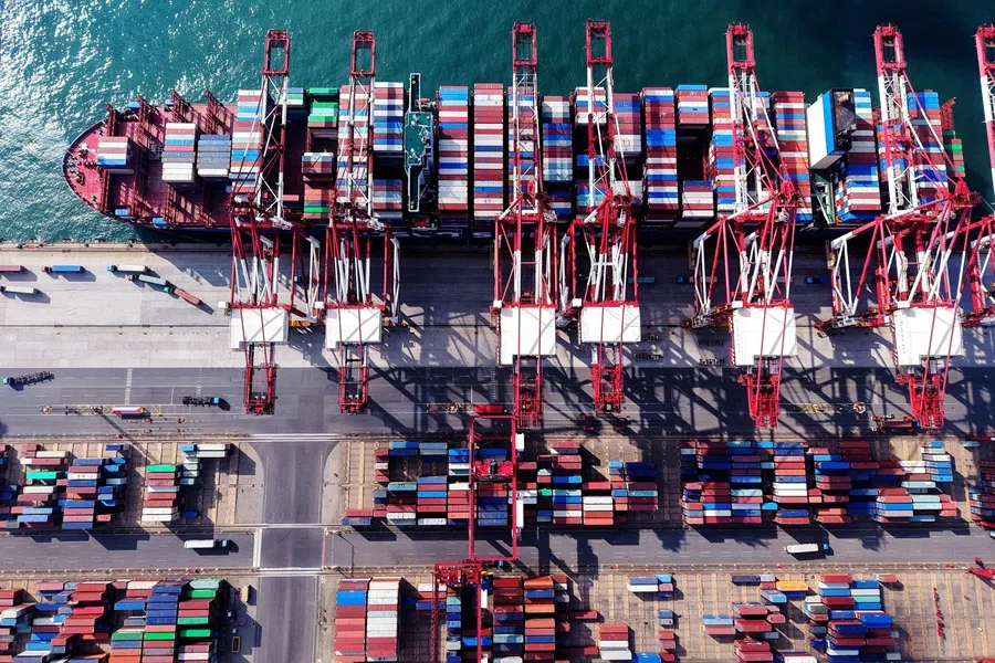 A container ship is berthed at the port in Qingdao, in China’s eastern Shandong province on 25 July 2025. (AFP)