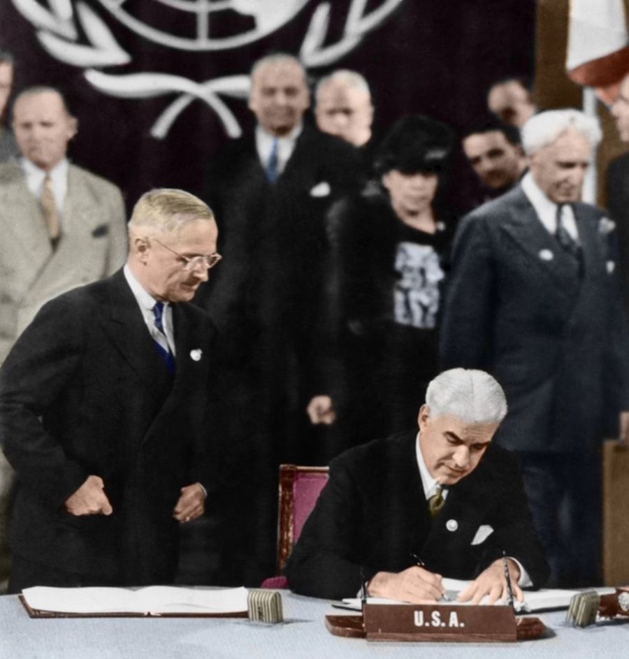 26 June 1945, San Francisco - US Secretary of State Edward R. Stettinius, Jr, chief delegate of the US delegation to the UNCIO meeting, is signing the UN Charter. Standing next to him is US President Harry S. Truman.