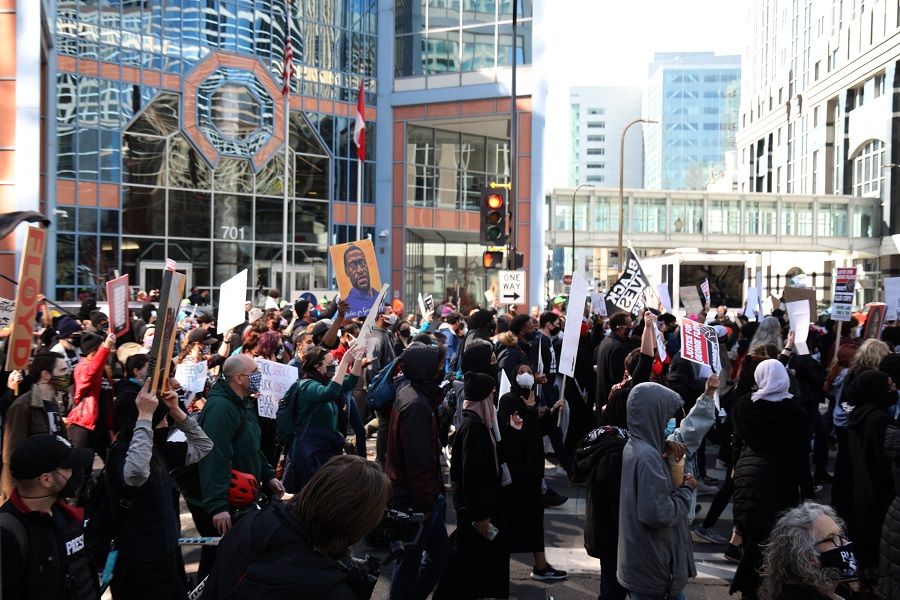 Demonstrators march outside the Hennepin County Government Center in Minneapolis, Minnesota, US, on 8 March 2021. The events last spring captured on viral footage that sparked calls for racial justice will be rehashed over a live broadcast from a socially-distanced courtroom, as a jury weighs whether the death of George Floyd that launched global support for the Black Lives Matter movement was a crime. (Emilie Richardson/Bloomberg)