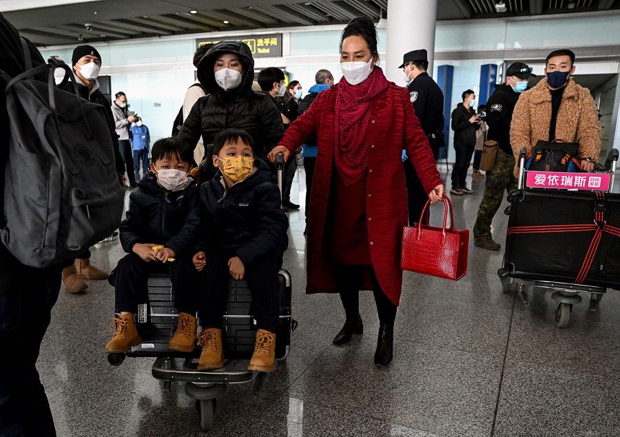 Passengers are seen in the arrivals area for international flights at the Beijing Capital International Airport in Beijing, China, on 8 January 2023. (Noel Celis/AFP)