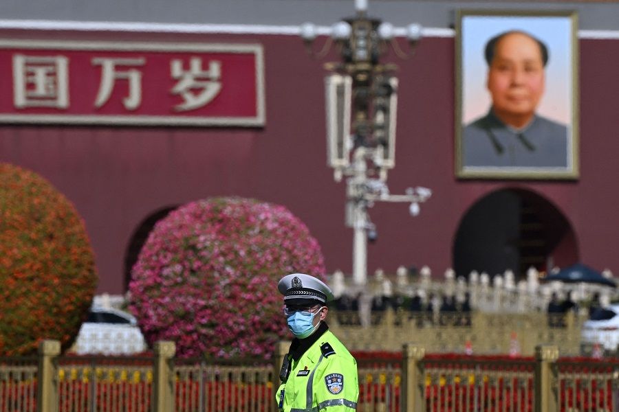 A police officer keeps watch after the introduction of the Chinese Communist Party's Politburo Standing Committee, the nation's top decision-making body, in Beijing, China, on 23 October 2022. (Noel Celis/AFP)