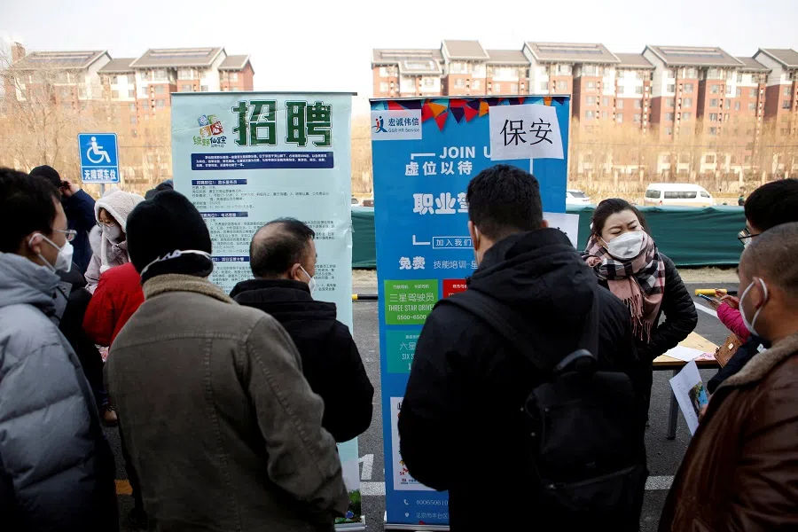 Job seekers attend a job fair in Beijing, China, on 16 February 2023. (Florence Lo/Reuters)