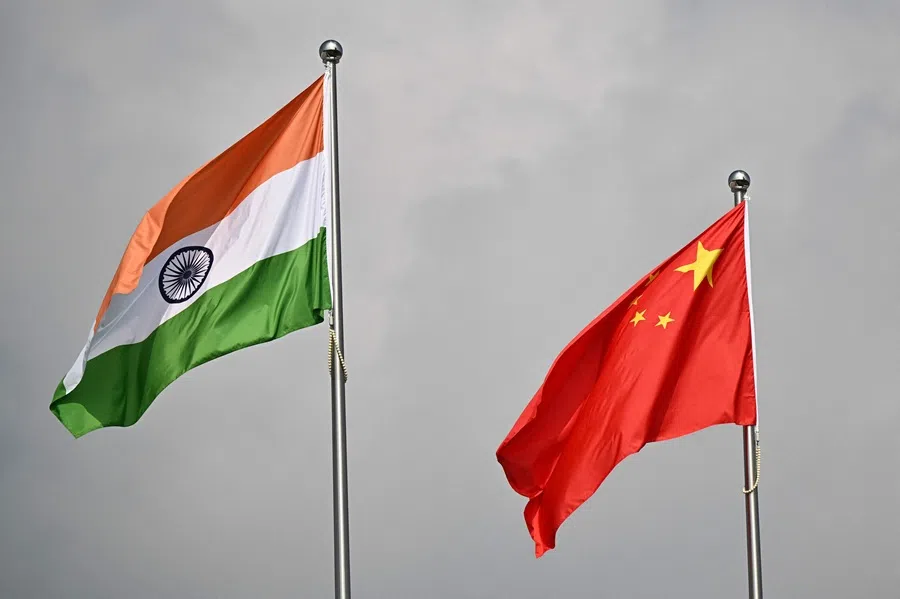 The flags of India and China are seen outside the Tianjin Meijiang Convention and Exhibition Center ahead of the Shanghai Cooperation Organisation (SCO) Summit in Tianjin on 31 August 2025.