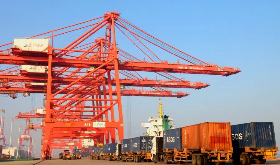 This photo taken on 7 December 2022 shows trucks queueing at a port in Lianyungang in China's eastern Jiangsu province. (AFP)