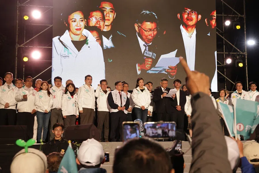 Taiwan People's Party (TPP) presidential candidate Ko Wen-je addresses supporters at the TPP headquarters in Xinzhuang in New Taipei City on 13 January 2024 with Huang Kuo-chang standing to Ko's left. (I-Hwa Cheng/AFP)