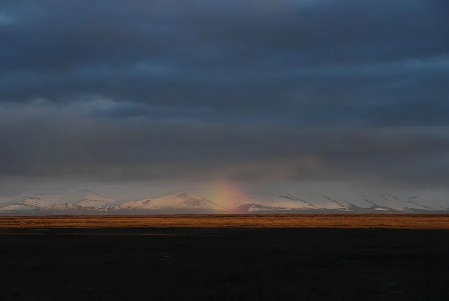 A rainbow is seen over the permafrost in the town of Quinhagak on the Yukon Delta, Alaska, on 12 April 2019. (Mark Ralston/AFP)