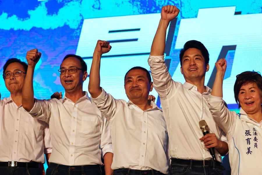 Kuomintang chairman Eric Chu (second from left), New Taipei City mayor Hou You-yi (third from left) and Wayne Chiang (second from right), Taipei mayoral candidate, take a group photo at a rally ahead of the election in Taoyuan, Taiwan, 19 November 2022. (Ann Wang/Reuters)