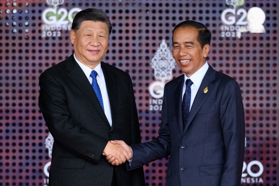 President Xi Jinping of China (left) is greeted by the President of the Indonesian Republic Joko Widodo during the formal welcome ceremony to mark the beginning of the G20 Summit on 15 November 2022 in Nusa Dua, Indonesia. (Leon Neal/Pool via Reuters)