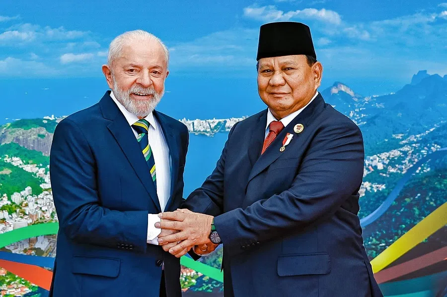 Handout picture released by the Brazilian Presidency showing Brazil’s President Luiz Inacio Lula da Silva posing for a picture with Indonesia’s President Prabowo Subianto on 18 November 2024. On 6 January 2025, Brazil, which holds the rotating presidency of the grouping in 2025, announced that Indonesia had become a full member of BRICS. 