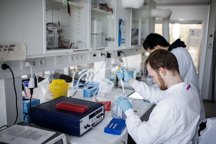 Researchers work on a vaccine against the Covid-19 coronavirus at a research lab in the University of Copenhagen, in Denmark, on 23 March 2020. (Thibault Savary/AFP)