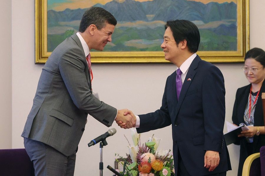 Taiwan Vice-President William Lai (right) is seen shaking hands with Paraguay's President-elect Santiago Pena at the Presidential Office in Taipei, Taiwan, in this handout picture taken and released by Taiwan's Presidential Office on 12 July 2023. (Handout/Taiwan's Presidential Office/AFP)
