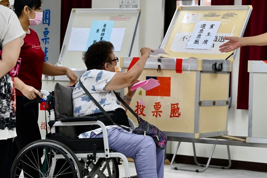 A member of Taiwan's main opposition party Kuomintang (KMT) votes to elect a new chairman at a polling station in Taipei, Taiwan, on 25 September 2021. (Sam Yeh/AFP)