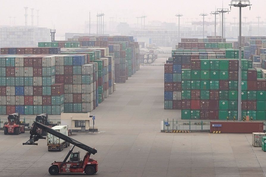 Stacks of containers are seen at the Yangshan Deep Water Port in Shanghai, China, 13 January 2022. (Aly Song/Reuters)