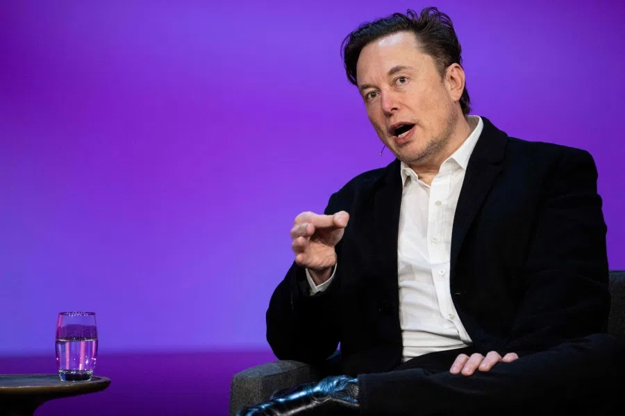 This handout photo taken on 14 April 2022 shows Tesla chief Elon Musk speaking at the TED2022: A New Era conference in Vancouver, Canada. (Ryan Lash/TED Conferences, LLC/AFP)