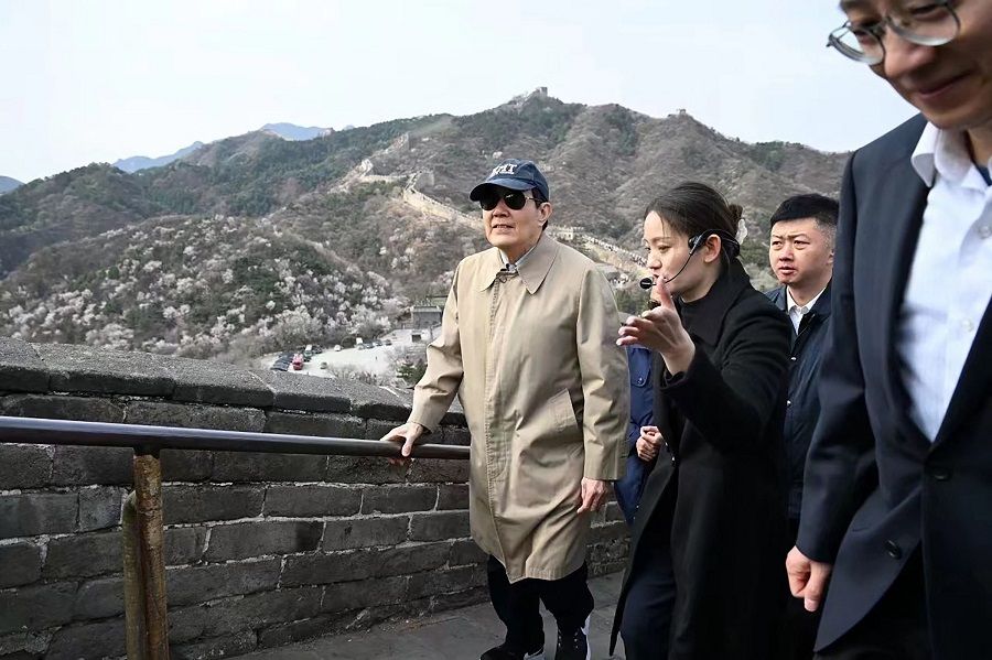 This handout picture taken and released by the Ma Ying-jeou Foundation on 9 April 2024 shows Taiwan's former president Ma Ying-jeou (left, wearing cap) visiting the Great Wall of China in the outskirts of Beijing. (Ma Ying-jeou Foundation/AFP)