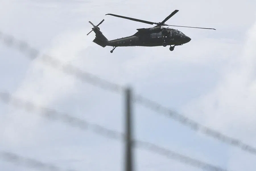 A UH-60 Black Hawk helicopter flies over during a military exercise at the Hengchun Airport in Pingtung county, southern Taiwan, 9 August 2022. (Reuters/Ann Wang)
