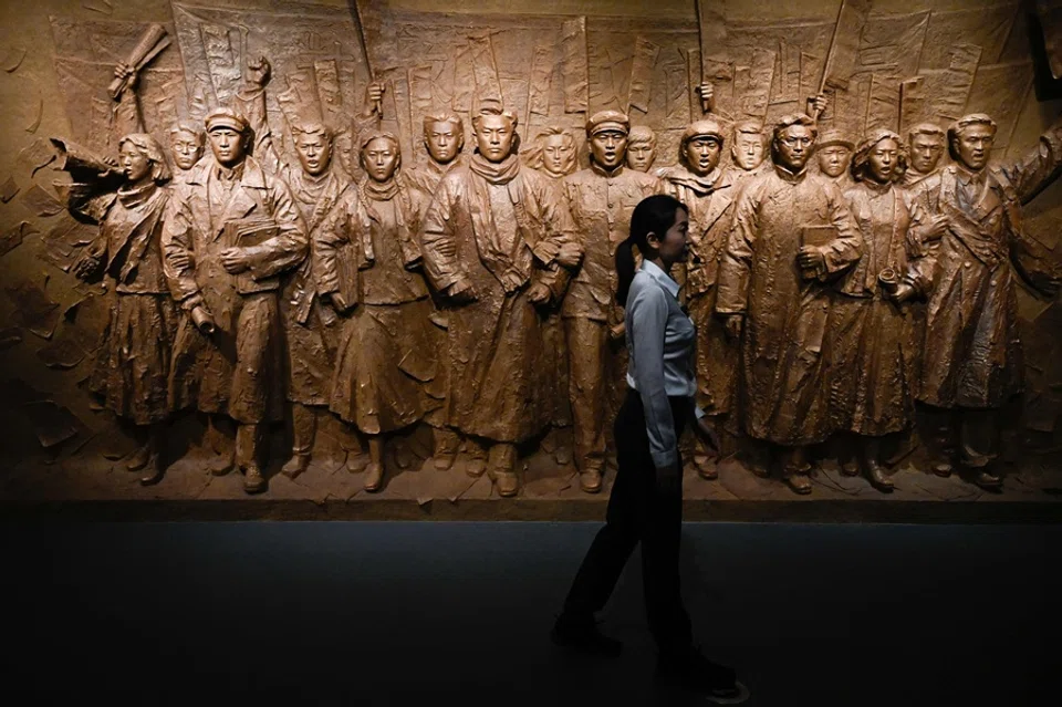 A guide is seen at an exhibition commemorating the 80th anniversary of the victory over Japan and the end of World War II at the Museum of the War of Chinese People’s Resistance Against Japanese Aggression in Beijing on 27 August 2025. (Wang Zhao/AFP)