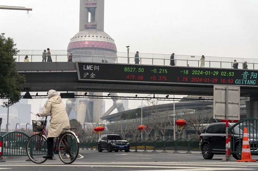 An electronic ticker displays stock figures in Pudong's Lujiazui Financial District in Shanghai, China, on 29 January 2024. (Raul Ariano/Bloomberg)