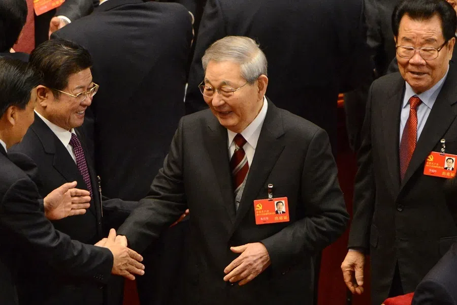 China's former Premier Zhu Rongji shakes hands with a delegate at the opening of the 18th Communist Party Congress at the Great Hall of the People in Beijing on 8 November 2012.