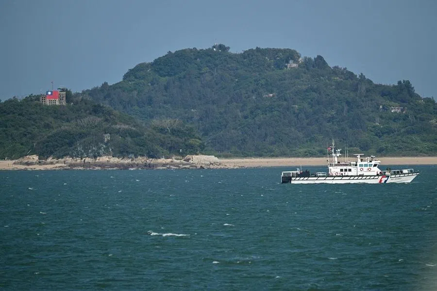 A Taiwan Coast Guard boat patrols, as seen from a boat with Chinese tourists, to observe Taiwan's Kinmen Islands, off Xiamen in mainland China’s Fujian province on 25 May 2026.